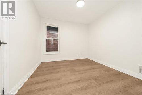 Unfurnished room featuring light wood-type flooring - 45 Munroe Street, Hamilton, ON - Indoor Photo Showing Other Room