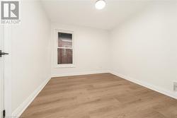 Unfurnished room featuring light wood-type flooring - 