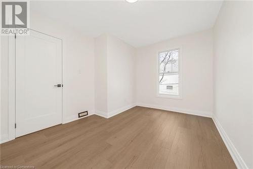 Empty room with light hardwood / wood-style flooring - 45 Munroe Street, Hamilton, ON - Indoor Photo Showing Other Room