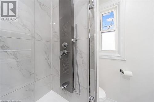 Bathroom with toilet and tiled shower - 45 Munroe Street, Hamilton, ON - Indoor Photo Showing Bathroom