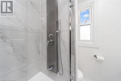 Bathroom with toilet and tiled shower - 