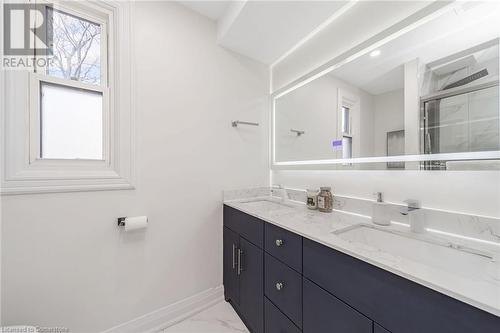 Bathroom with vanity and a shower with door - 45 Munroe Street, Hamilton, ON - Indoor Photo Showing Bathroom