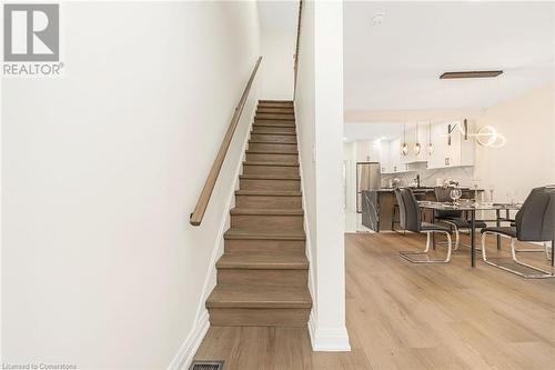 Stairs featuring hardwood / wood-style floors - 45 Munroe Street, Hamilton, ON - Indoor Photo Showing Other Room