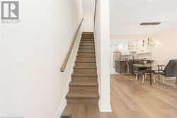 Stairs featuring hardwood / wood-style floors - 