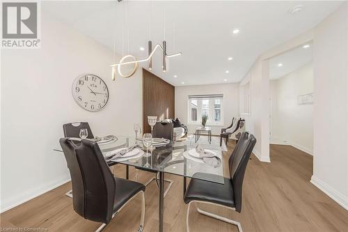 Dining room featuring light wood-type flooring - 45 Munroe Street, Hamilton, ON - Indoor Photo Showing Dining Room