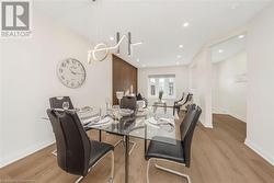 Dining room featuring light wood-type flooring - 