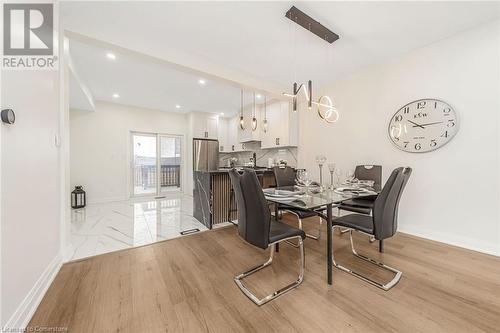 Dining area featuring light hardwood / wood-style flooring - 45 Munroe Street, Hamilton, ON - Indoor Photo Showing Dining Room