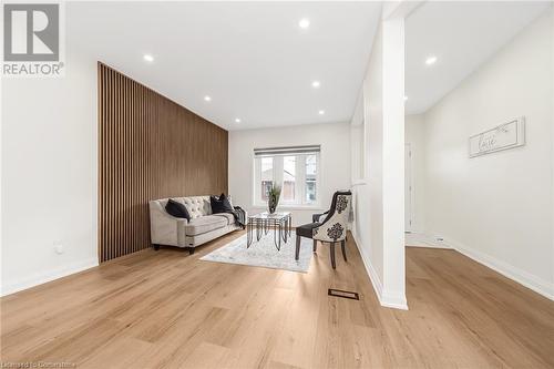 Living room featuring light hardwood / wood-style flooring - 45 Munroe Street, Hamilton, ON - Indoor