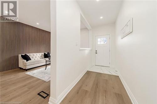 Doorway to outside featuring light hardwood / wood-style flooring - 45 Munroe Street, Hamilton, ON - Indoor Photo Showing Other Room