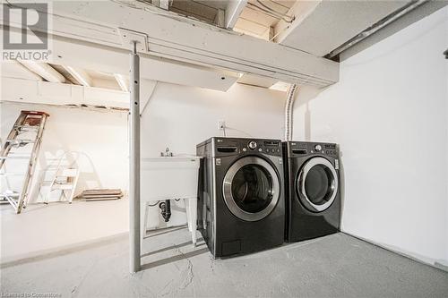 Clothes washing area with independent washer and dryer - 45 Munroe Street, Hamilton, ON - Indoor Photo Showing Laundry Room