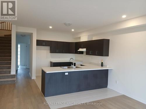 12-397 Garrison Road, Fort Erie (333 - Lakeshore), ON - Indoor Photo Showing Kitchen With Double Sink