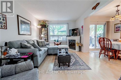 2 - 64 Forster Street, St. Catharines (442 - Vine/Linwell), ON - Indoor Photo Showing Living Room With Fireplace