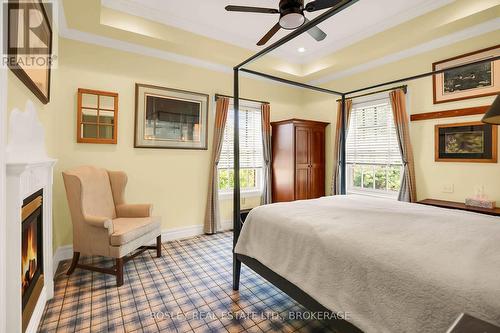 619 King Street, Niagara-On-The-Lake (101 - Town), ON - Indoor Photo Showing Bedroom With Fireplace