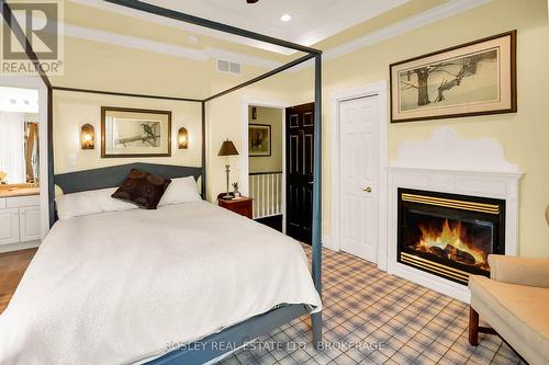 619 King Street, Niagara-On-The-Lake (101 - Town), ON - Indoor Photo Showing Bedroom With Fireplace