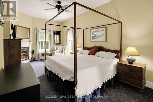 619 King Street, Niagara-On-The-Lake (101 - Town), ON - Indoor Photo Showing Bedroom With Fireplace