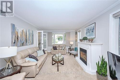 3378 Saint Patrick Avenue, Niagara Falls (206 - Stamford), ON - Indoor Photo Showing Living Room With Fireplace