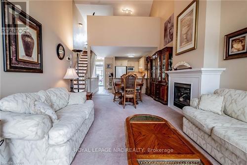 15 - 4300 Kalar Road, Niagara Falls (213 - Ascot), ON - Indoor Photo Showing Living Room With Fireplace