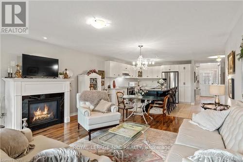 11 - 77 Avery Crescent, St. Catharines (456 - Oakdale), ON - Indoor Photo Showing Living Room With Fireplace