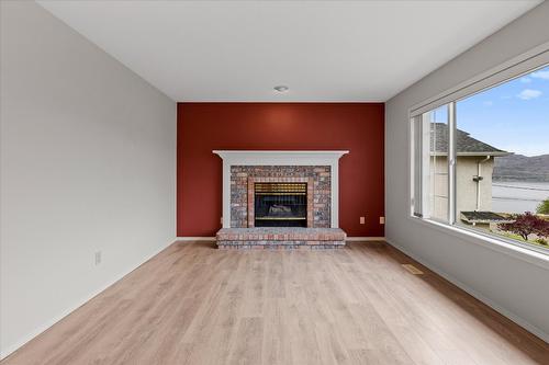 6133 Aitkens Road, Peachland, BC - Indoor Photo Showing Living Room With Fireplace