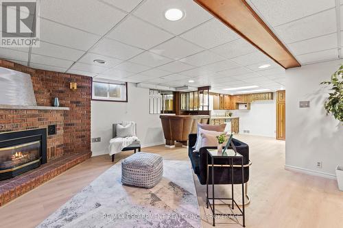 12 Broderick Avenue, Thorold (557 - Thorold Downtown), ON - Indoor Photo Showing Living Room With Fireplace