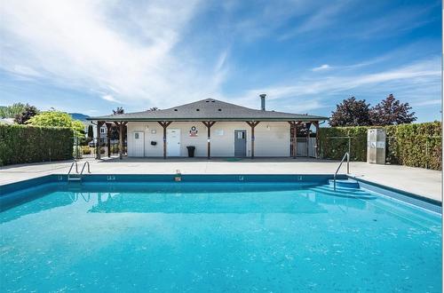 7-4450 Postill Drive, Kelowna, BC - Outdoor With In Ground Pool With Backyard