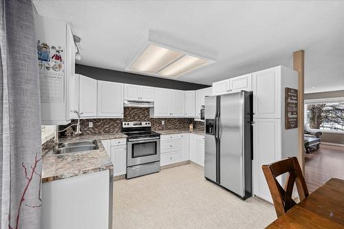 7-4450 Postill Drive, Kelowna, BC - Indoor Photo Showing Kitchen With Double Sink