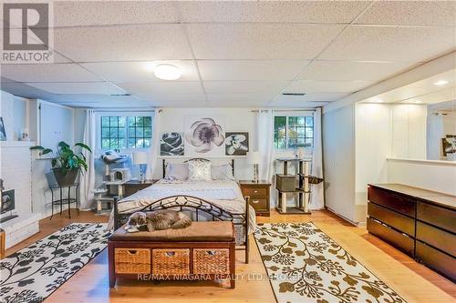 3195 St. Patrick Avenue, Niagara Falls (206 - Stamford), ON - Indoor Photo Showing Bedroom With Fireplace