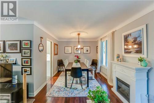 3195 St. Patrick Avenue, Niagara Falls (206 - Stamford), ON - Indoor Photo Showing Dining Room With Fireplace