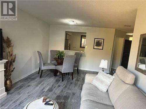 504 - 8111 Forest Glen Drive, Niagara Falls (208 - Mt. Carmel), ON - Indoor Photo Showing Living Room With Fireplace