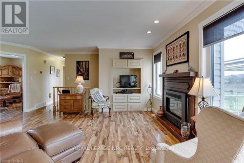 454 Holloway Bay Road S, Port Colborne (874 - Sherkston), ON - Indoor Photo Showing Living Room With Fireplace