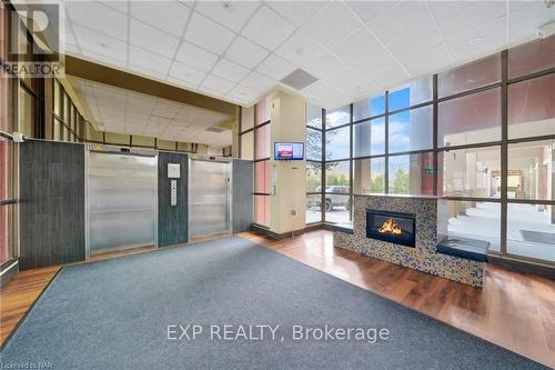 836 - 350 Quigley Road, Hamilton (Vincent), ON - Indoor Photo Showing Other Room With Fireplace