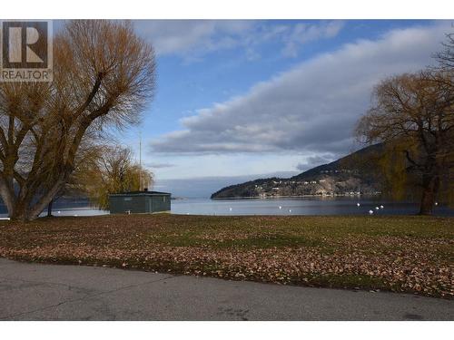 Located right across the street from Lake Okanagan - 36 Lakeshore Drive, Vernon, BC - Outdoor With Body Of Water With View