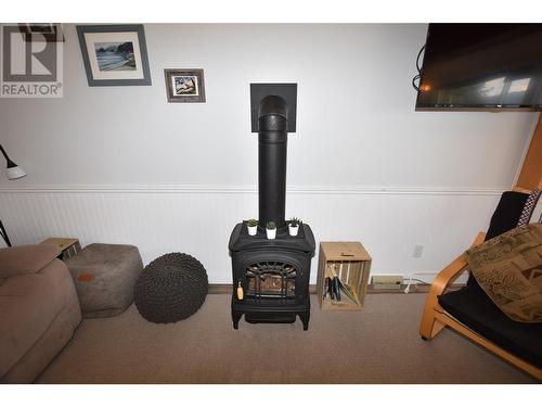 Gas fireplace (Propane) takes the chill off on a cool day - 36 Lakeshore Drive, Vernon, BC - Indoor Photo Showing Other Room