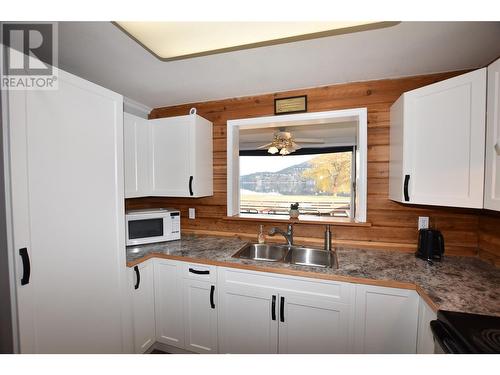 pass through from kitchen to dining area - 36 Lakeshore Drive, Vernon, BC - Indoor Photo Showing Kitchen With Double Sink