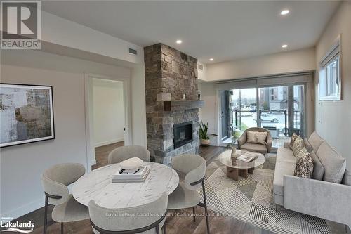 207 - 11 Beckwith Lane, Blue Mountains (Blue Mountain Resort Area), ON - Indoor Photo Showing Living Room With Fireplace