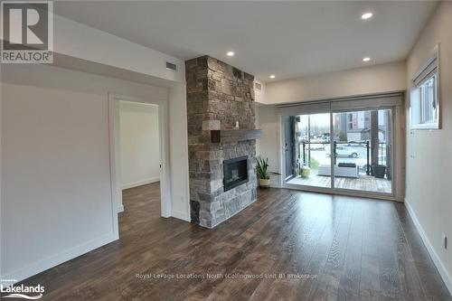 207 - 11 Beckwith Lane, Blue Mountains (Blue Mountain Resort Area), ON - Indoor Photo Showing Living Room With Fireplace