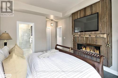 104 Clippers Lane, Blue Mountains, ON - Indoor Photo Showing Bedroom With Fireplace