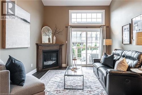 221 - 50 Galt Road Road, Stratford, ON - Indoor Photo Showing Living Room With Fireplace