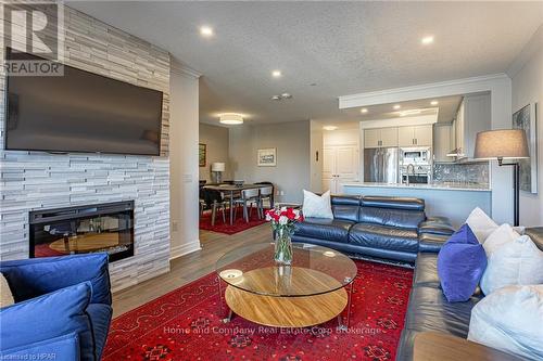 405 - 235 John Street N, Stratford, ON - Indoor Photo Showing Living Room With Fireplace