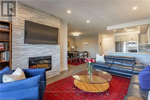 405 - 235 John Street N, Stratford, ON - Indoor Photo Showing Living Room With Fireplace