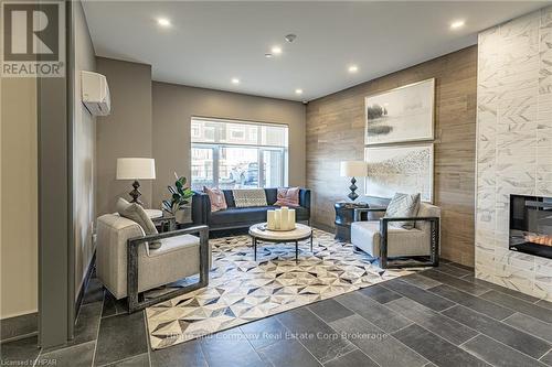 405 - 235 John Street N, Stratford, ON - Indoor Photo Showing Living Room With Fireplace