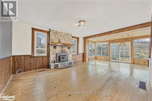 556341 6Th Line, Blue Mountains, ON - Indoor Photo Showing Living Room With Fireplace