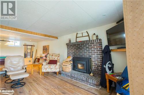 562 & 568 Waseosa Lake Road, Huntsville (Chaffey), ON - Indoor With Fireplace