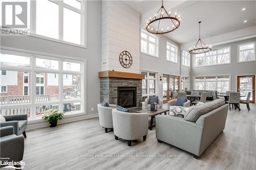 401 - 200 Anglo Street, Bracebridge (Macaulay), ON - Indoor Photo Showing Living Room With Fireplace