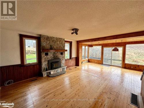 556341 6Th Line, Blue Mountains, ON - Indoor Photo Showing Living Room With Fireplace