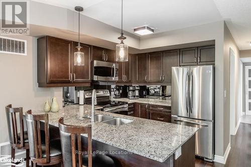 308 - 4 Brandy Lane Drive, Collingwood, ON - Indoor Photo Showing Kitchen With Stainless Steel Kitchen With Double Sink With Upgraded Kitchen