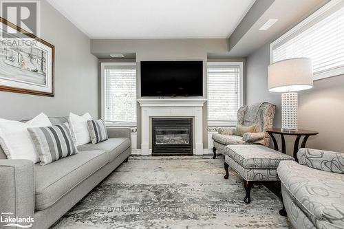 308 - 4 Brandy Lane Drive, Collingwood, ON - Indoor Photo Showing Living Room With Fireplace