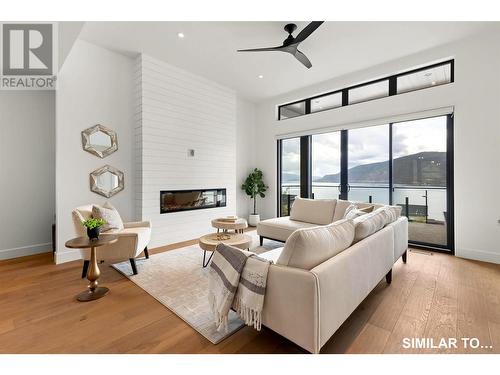 11 ft ceilings - 9201 Okanagan Centre Road W Unit# 5, Lake Country, BC - Indoor Photo Showing Living Room With Fireplace