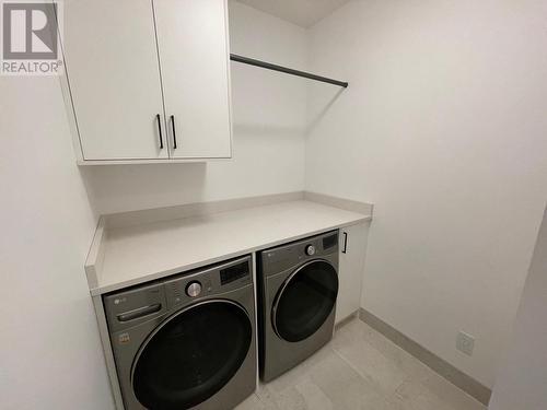 Steam Washer and Dryer - 9201 Okanagan Centre Road W Unit# 5, Lake Country, BC - Indoor Photo Showing Laundry Room