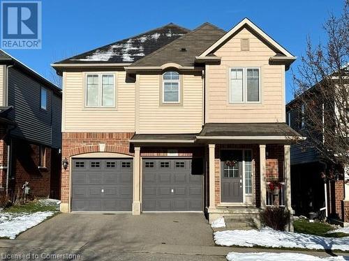 View of front of home with a garage - 683 Robert Ferrie Drive, Kitchener, ON - Outdoor With Facade